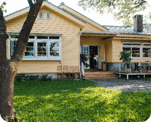 Charming Yellow House With Wooden Windows Green Grassy Garden